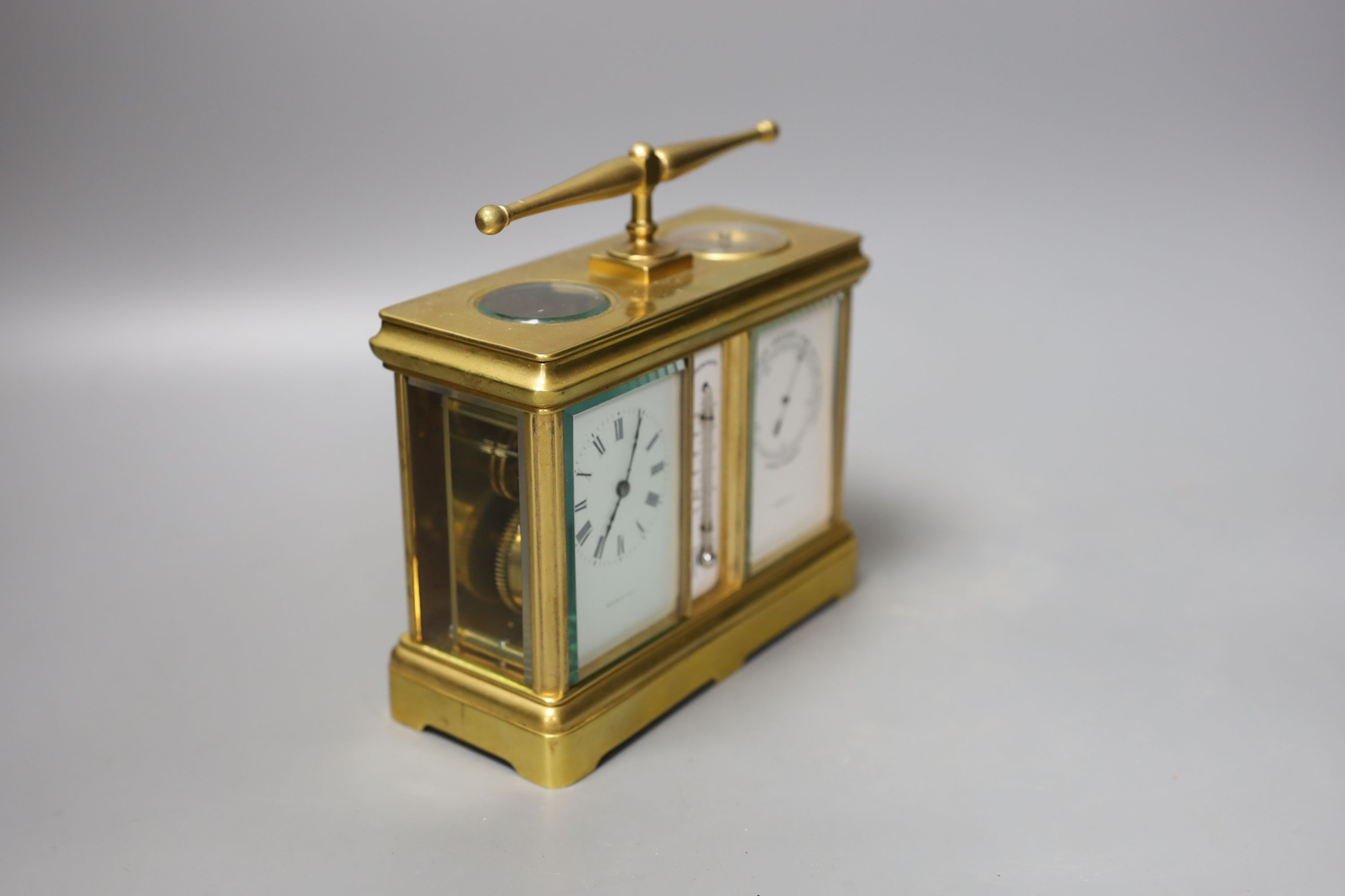 A French combination brass carriage timepiece, barometer, thermometer and compass, retailed by Reed & Son